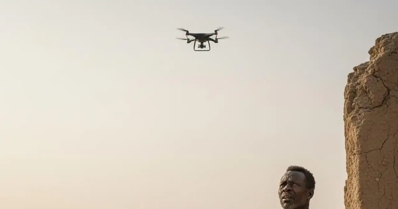 Civilian looking at the sky amid conflict in Darfur