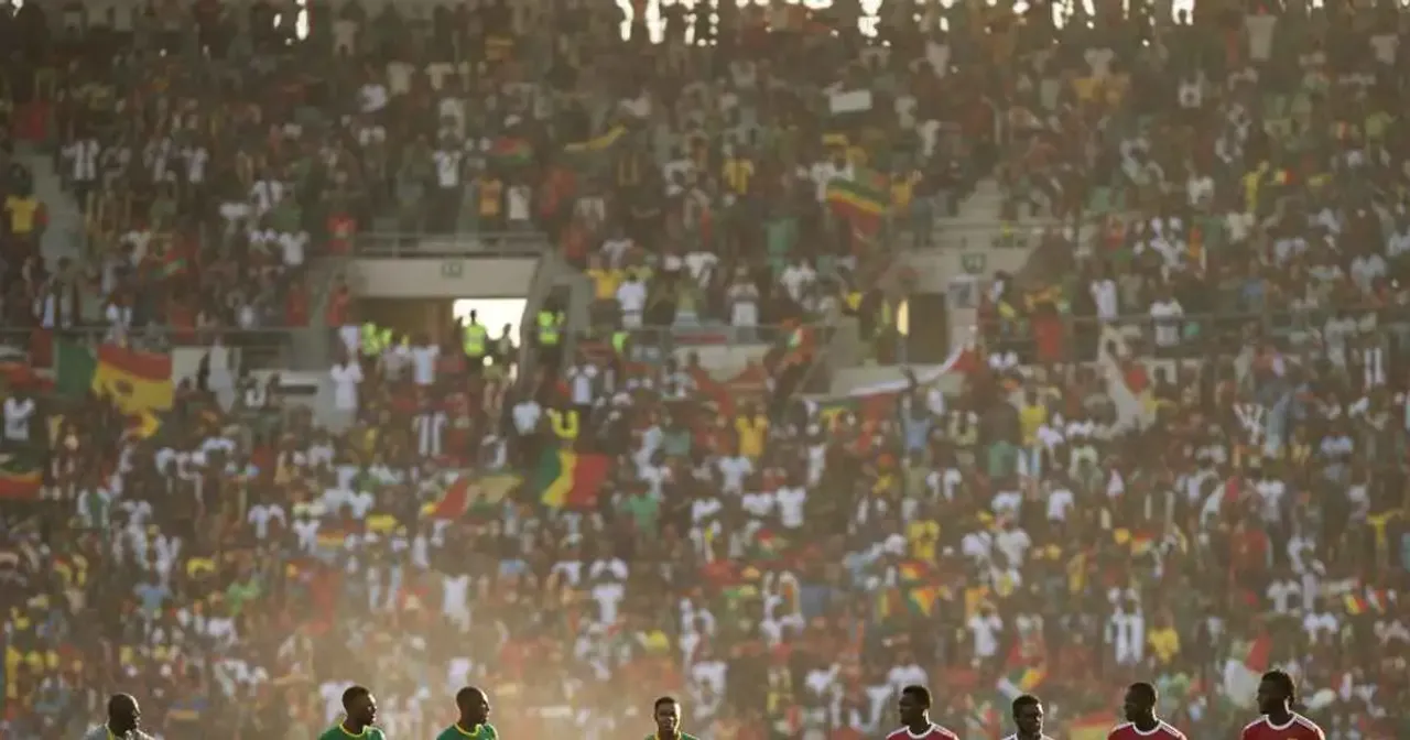 African international football match showing tactical positioning and coaching instructions